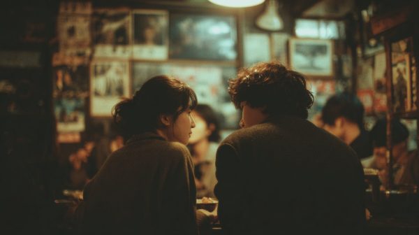 A couple sharing a quiet meal in a cozy, old noodle shop.